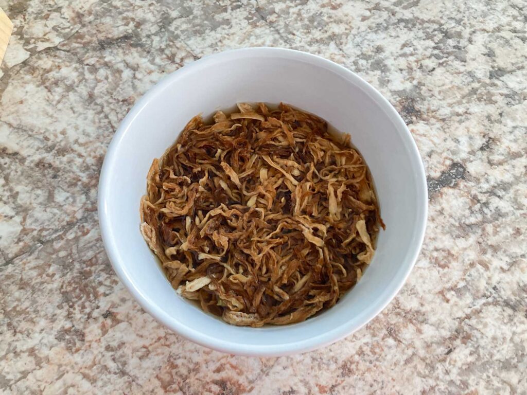 kiriboshi daikon is soaked in water in a white bowl