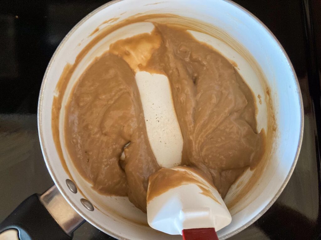 heating up chocolate custard in a pot