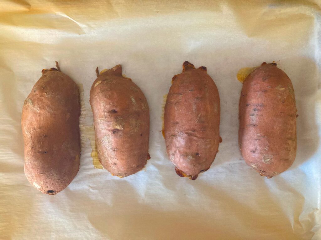 roasted sweet potatoes on parchment paper