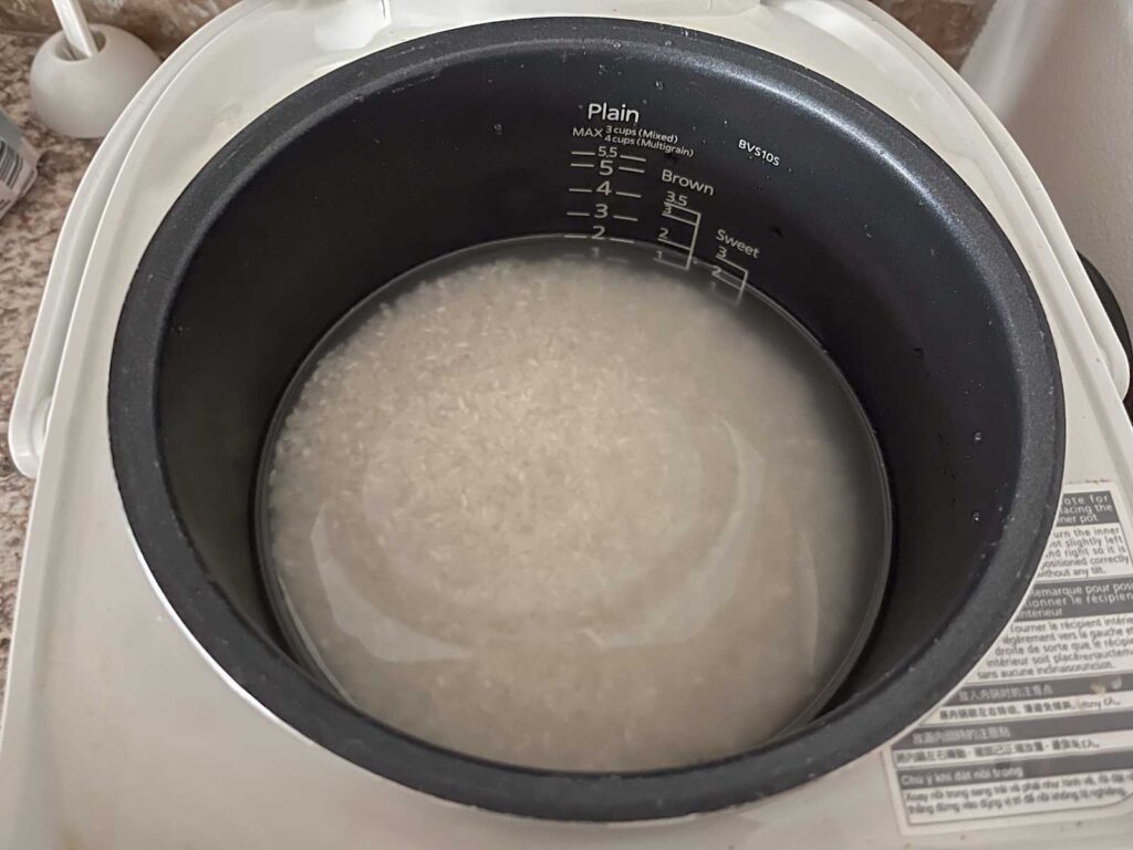 rice is soaked in a rice cooker