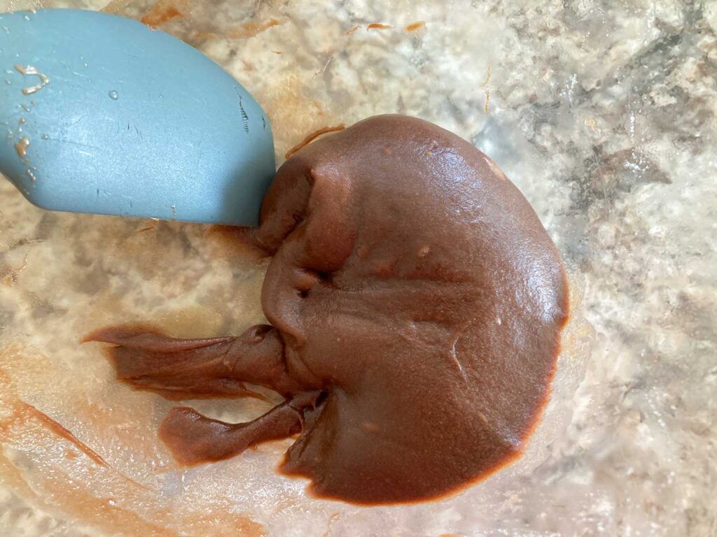 chocolate mochi is microwaved and kneaded in a bowl