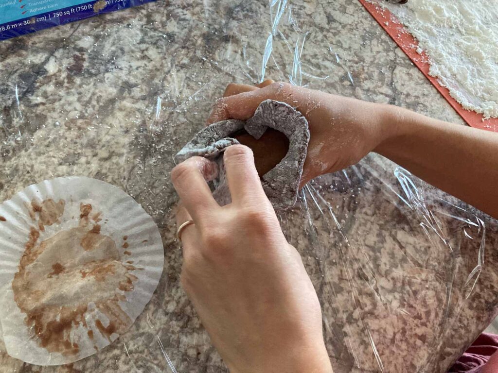 scooped chocolate ice cream is wrapped in chocolate mochi