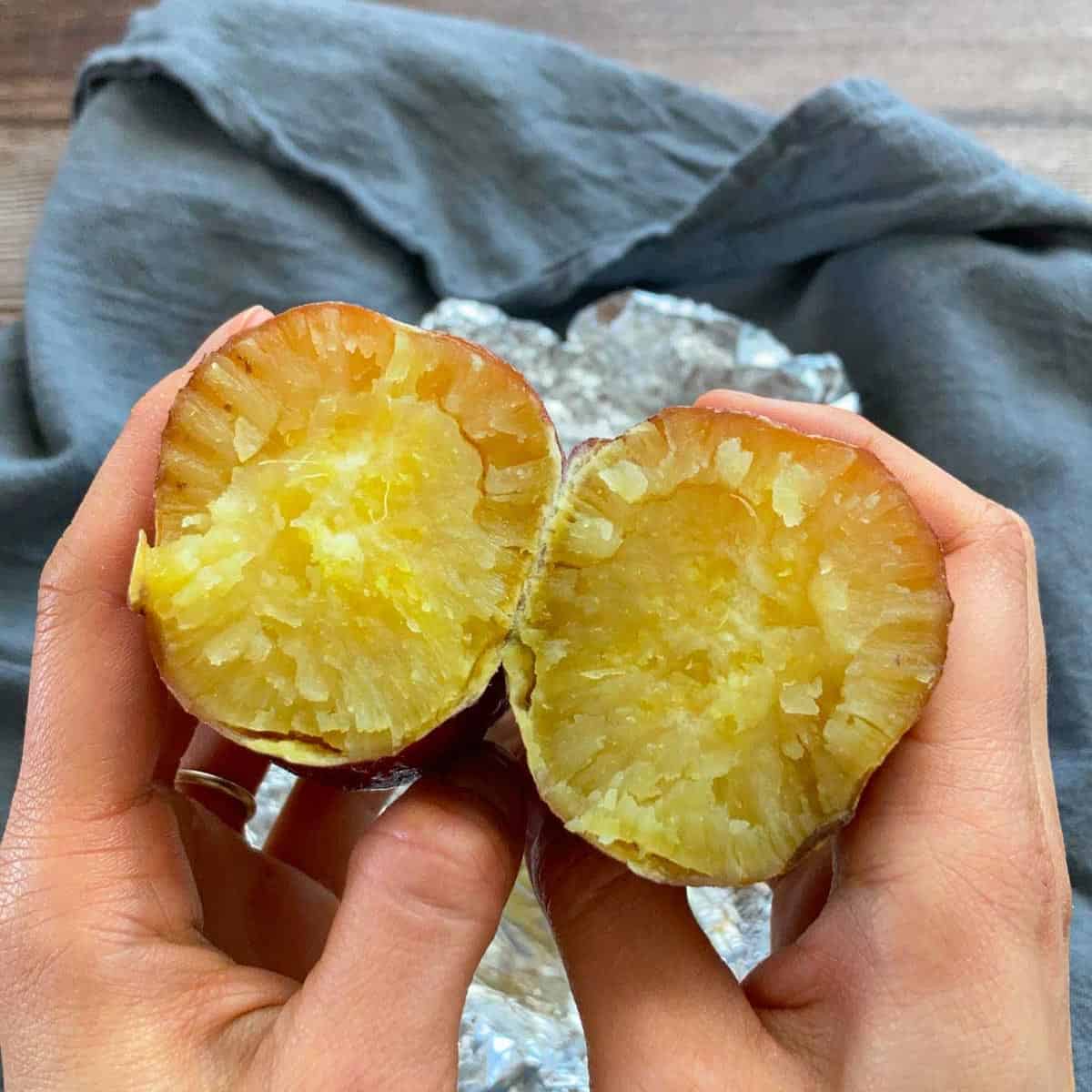Baked Japanese sweet potatoes are cut into half.