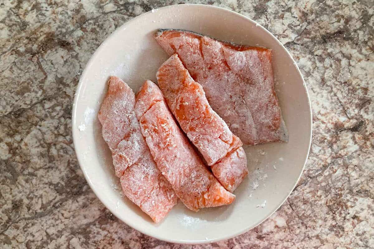 salmon coated with all purpose flour.