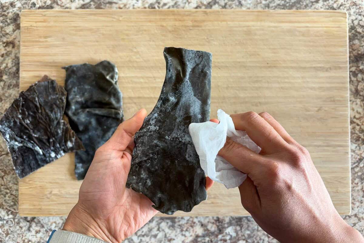 wipe kombu with a dumped paper towel.