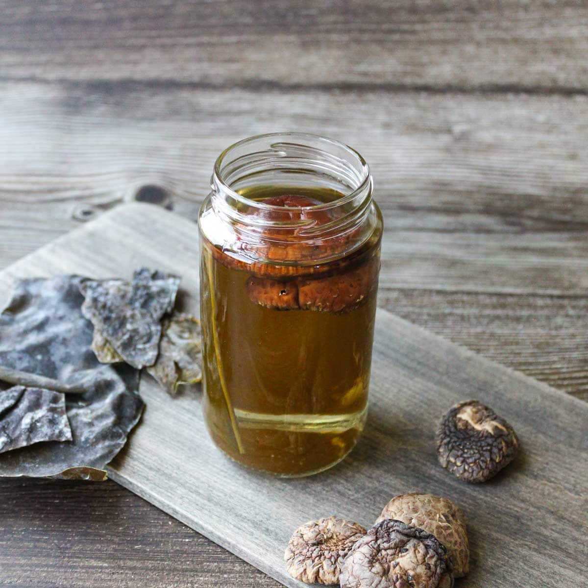 Japanese kombu and dried shiitake dashi in a container.