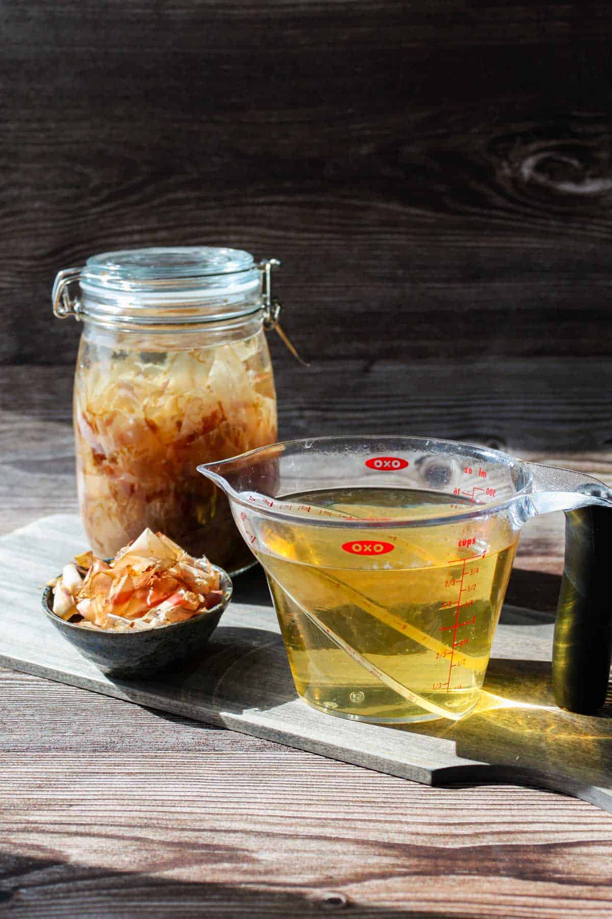 Cold brew katsuo dashi in a jar on the left and regular dashi on the right.
