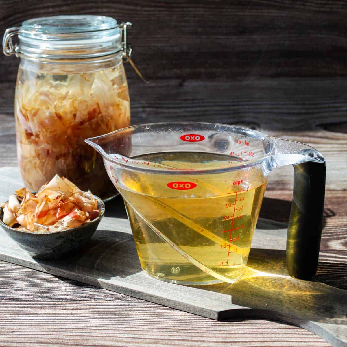 Cold brew katsuo dashi in a jar on the left and regular dashi on the right.