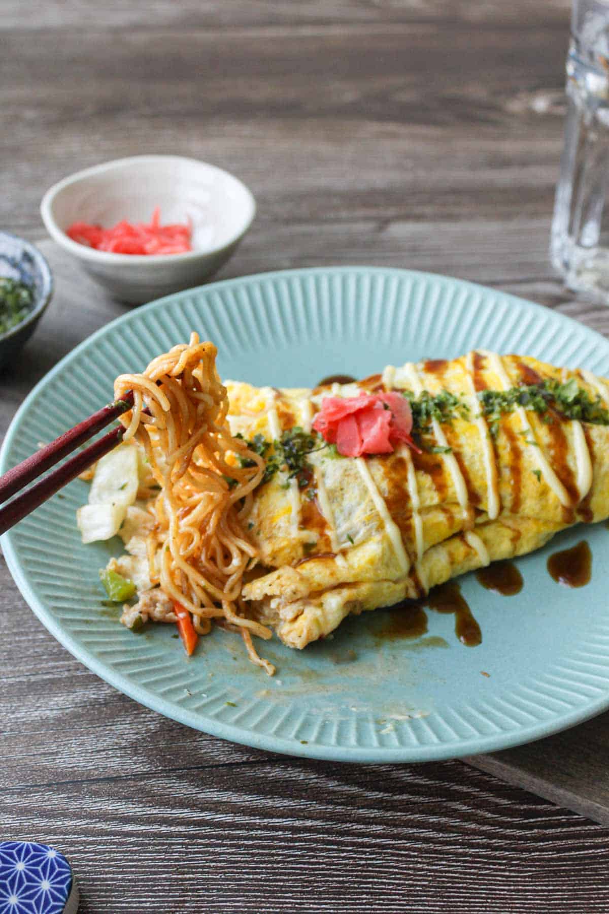 Omusoba, Japanese stir fry noodles (yakisoba) wrapped in omelet.