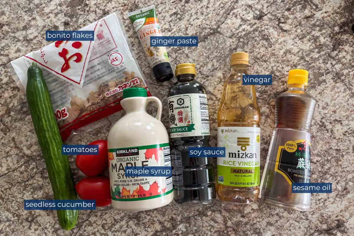Ingredients to make Japanese tomato salad with cucumbers and bonito flakes.