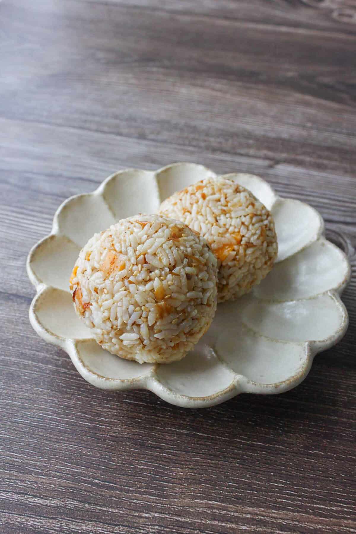 Cheese okaka onigiri on a plate.