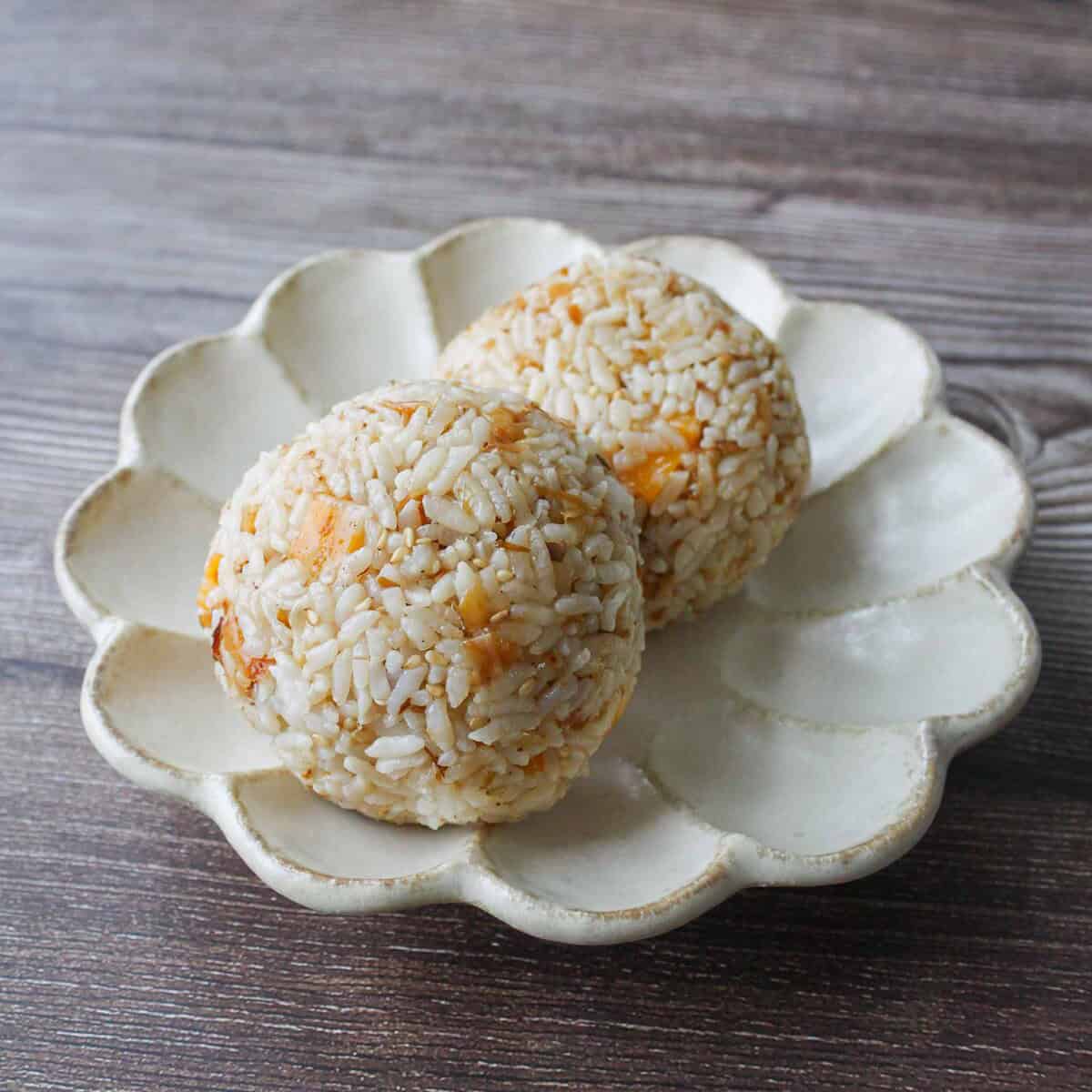 Cheese okaka onigiri on a plate.