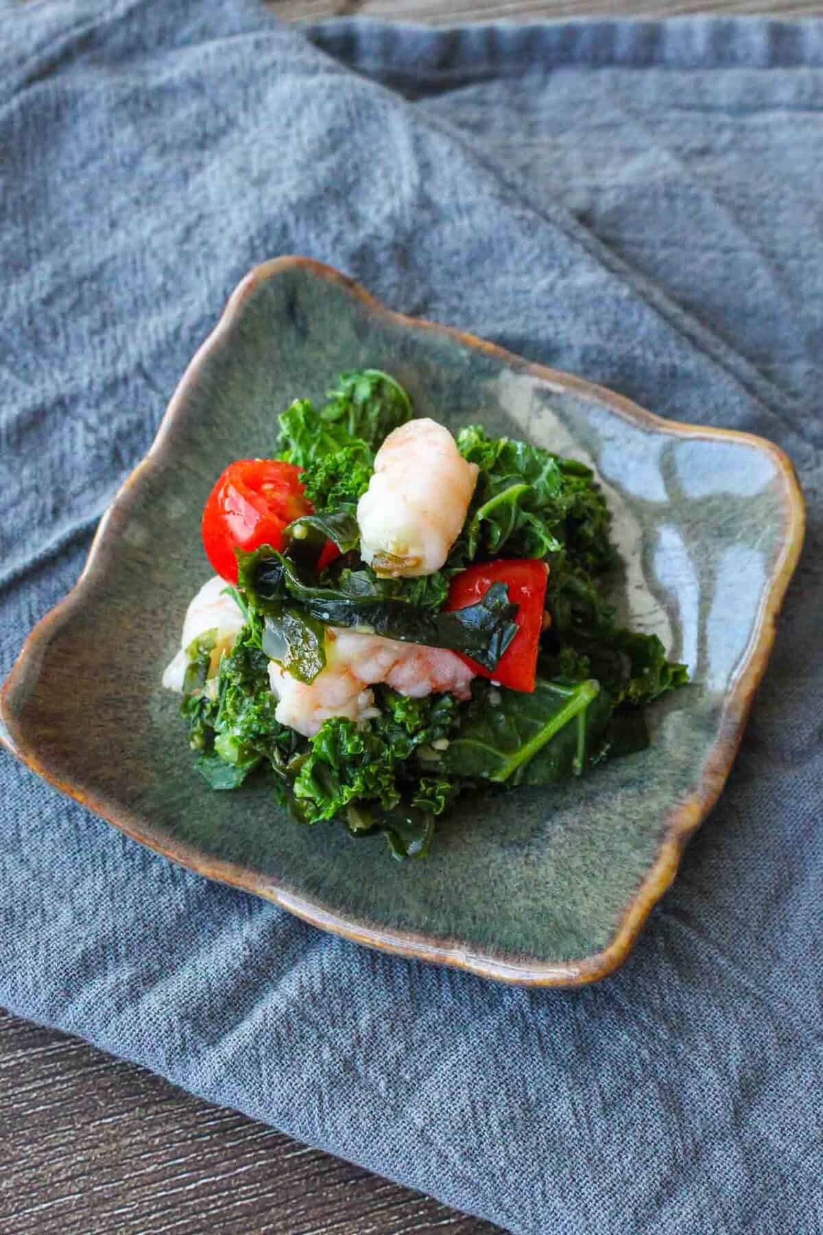 Japanese miso vinaigrette salad with kale and shrimps.