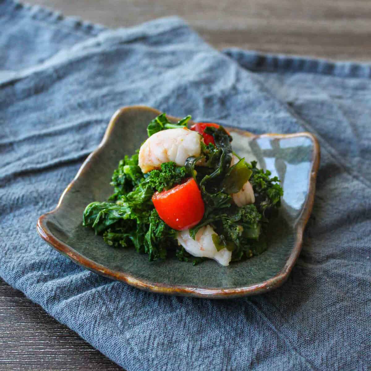 Japanese miso vinaigrette salad with kale and shrimps.