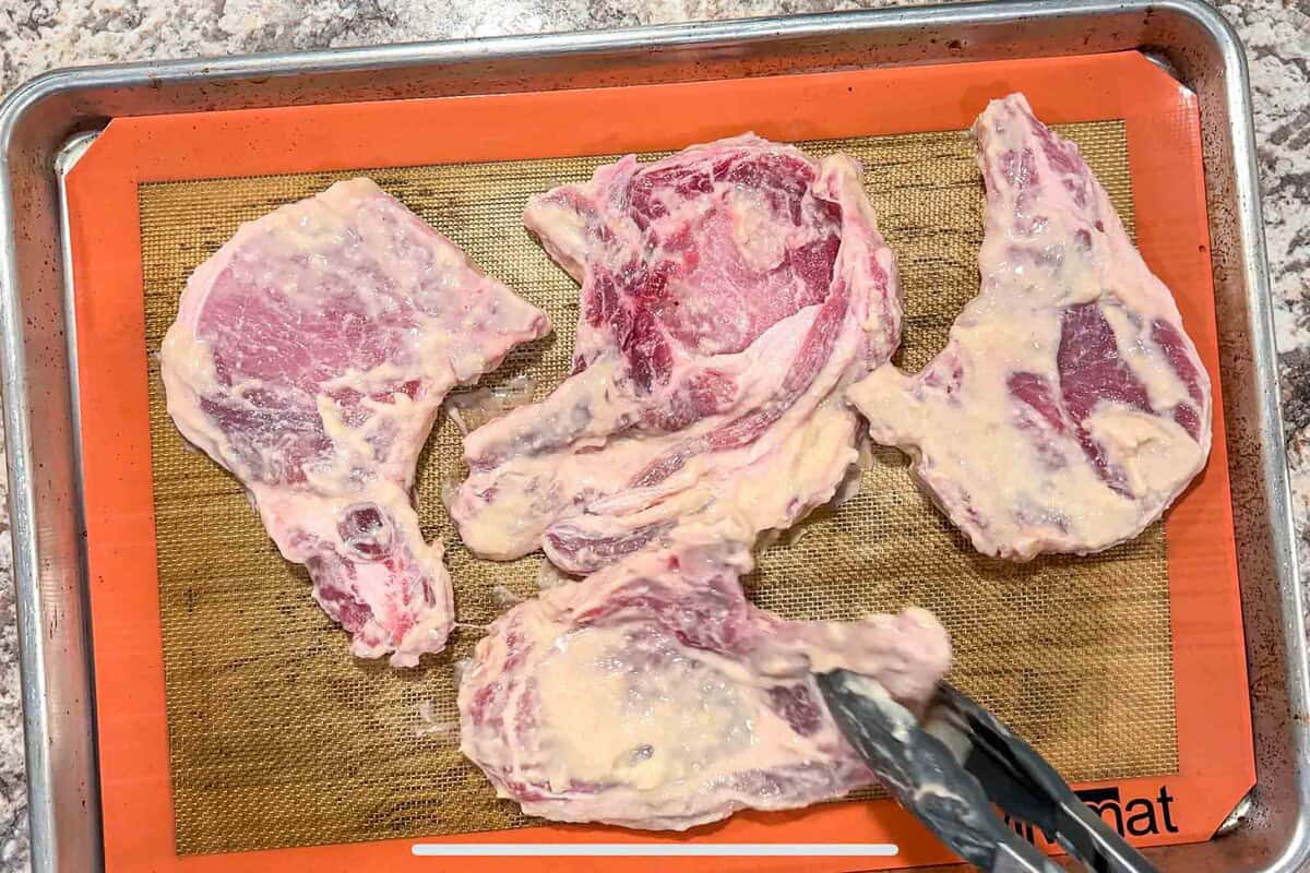 Place pork chops on a baking sheet.