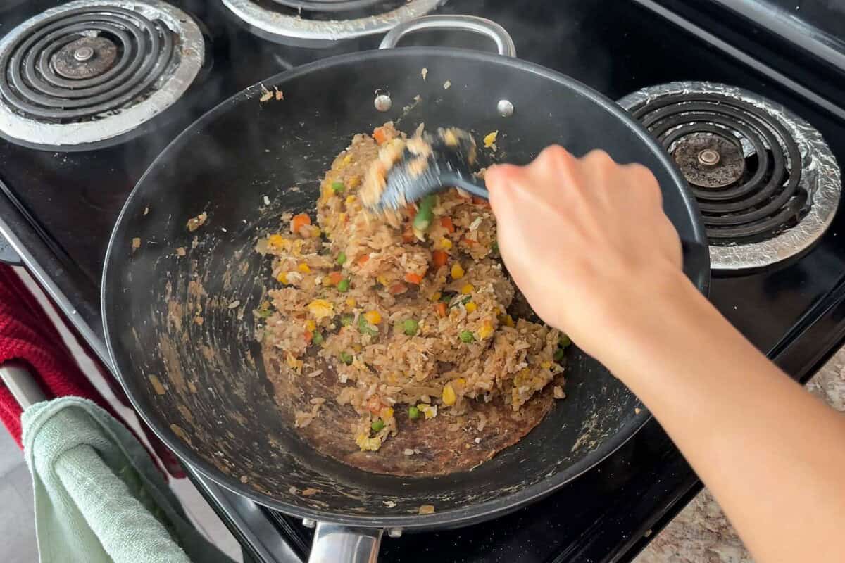 Add the egg back to the pan.